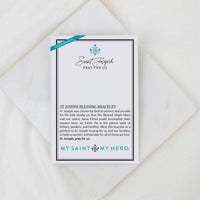 Card packaging for St. Joseph blessing bracelet with text and branding on a white background