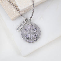 Close-up of Pope John Paul II coat of arms on the St. John Paul II Fearless Medal Necklace – exclusively designed by Vatican artist for My Saint My Hero