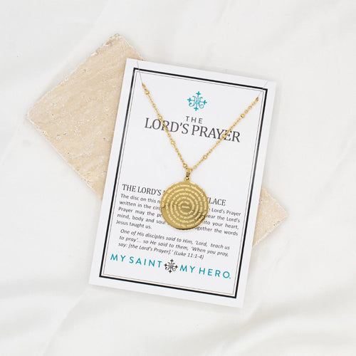 The Lord's Prayer Necklace on it's inspirational card in gold tone