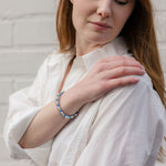 woman wearing the blue woven mary bracelet