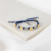 image of a blue woven benedictine blessing bracelet