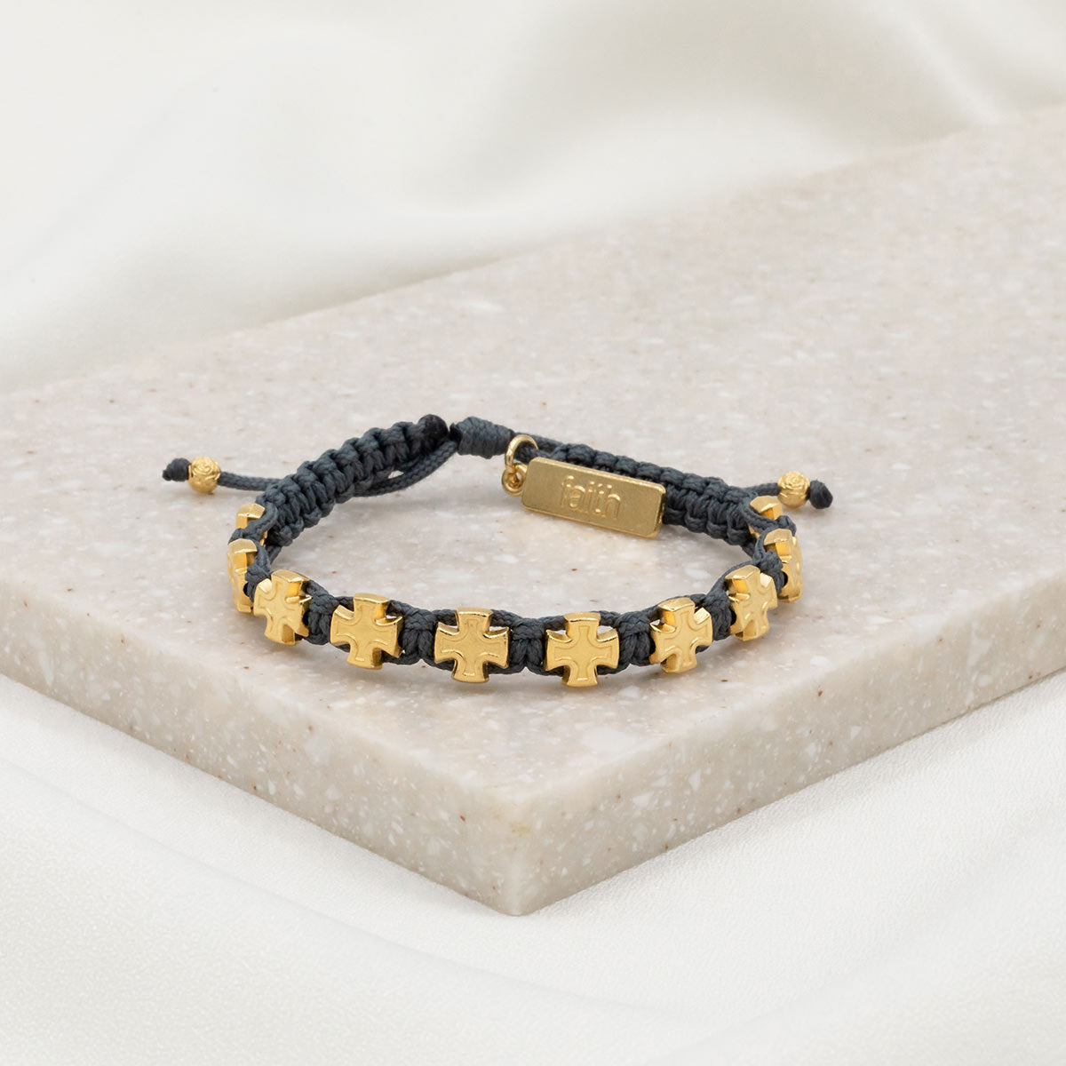 slate cording and gold tone cross medals