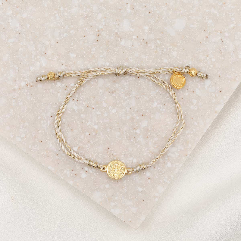 Petite St. Benedict Breath Bracelet, gold-tone medal, gold metallic bracelet cording with slipknot closure