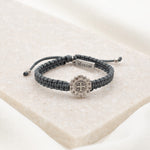 Slate cording and silver tone Benedictine Medal surrounded by crystals Brilliance Blessing Bracelet