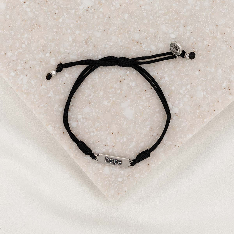 black cording slip knot bracelet with silver tone medals, main rectangle medal with word hope