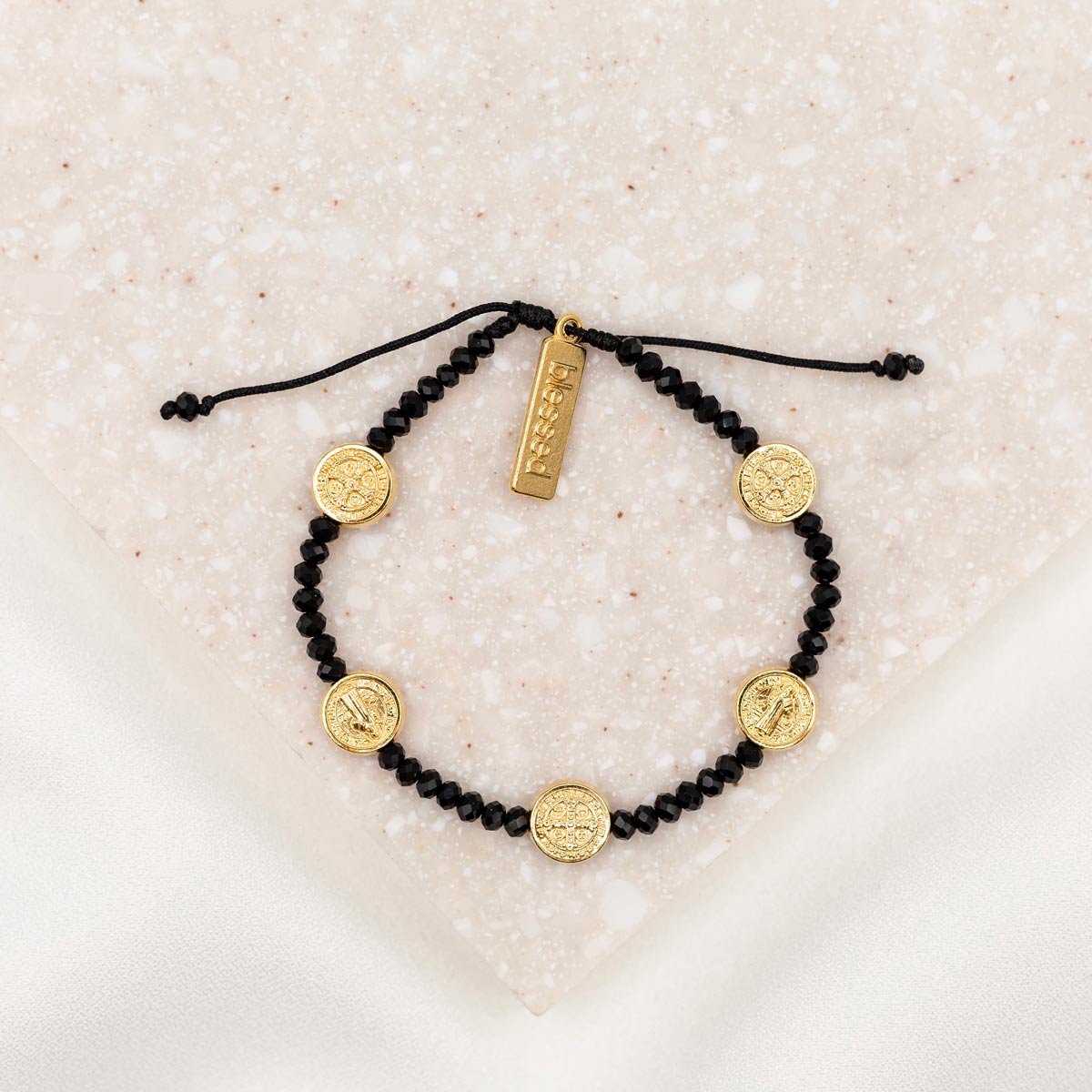 Stellar Blessings Night Sky Crystal and Benedictine Medal Blessing Bracelet with gold tone blessed charm and black crystals