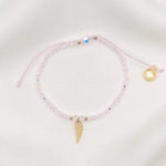 Angelic Light Bracelet with clear crystal beads and gold angel wing charm, pink threading