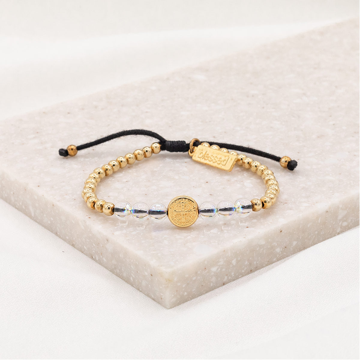 6 European crystals, silver or gold-tone beads with a silver or gold-tone Benedictine medal in the center and our signature "blessed" charm