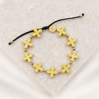 Grounded in Faith Howlite  Cross Bracelet yellow dyed gemstone with gold blessed medal and beads on string knot style cording