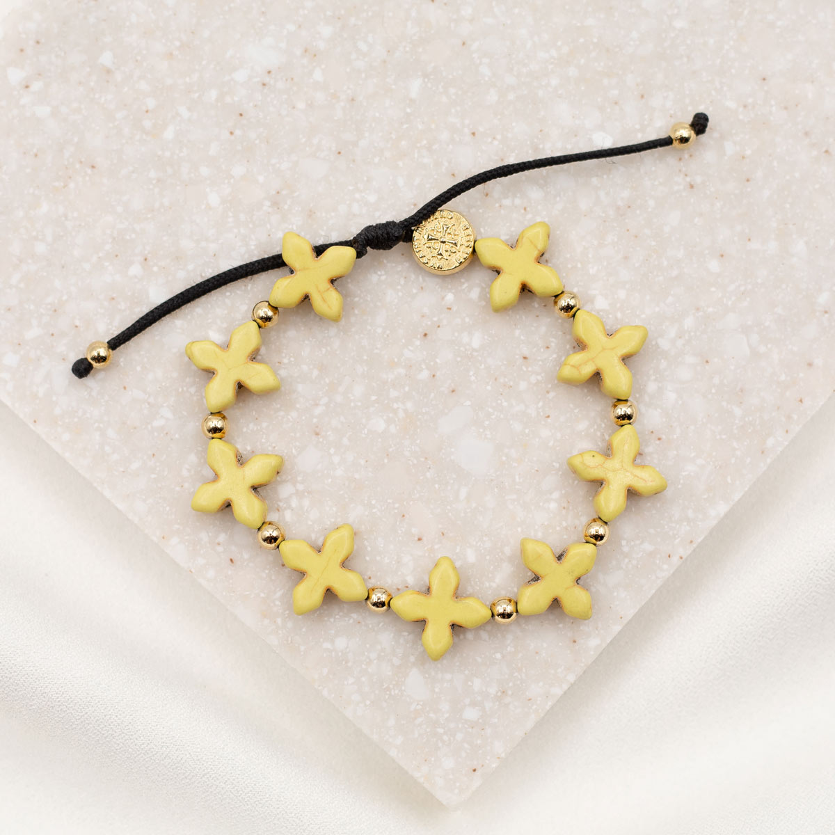 Grounded in Faith Howlite  Cross Bracelet yellow dyed gemstone with gold blessed medal and beads on string knot style cording