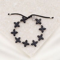 Grounded in Faith Howlite  Cross Bracelet black crosses silver medal and beads on black cording