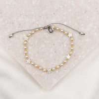 Made for this Moment Esther 4:14 Bracelet in collaboration with Madi Prewett mother of pearl stars and crystal pearls on slipknot cording