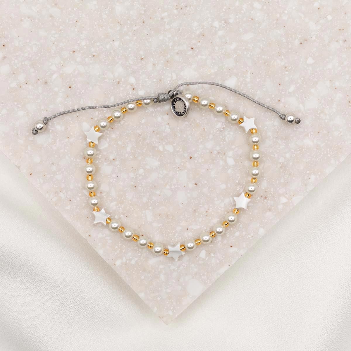 Made for this Moment Esther 4:14 Bracelet in collaboration with Madi Prewett mother of pearl stars and crystal pearls on slipknot cording