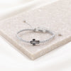 Faith Confirmed crystal cross handwoven bracelet with silver metallic thread and a faith silver tag charm