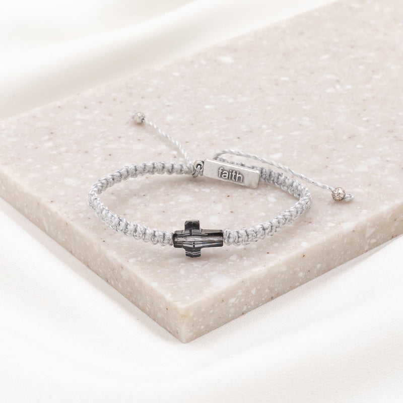 Faith Confirmed crystal cross handwoven bracelet with silver metallic thread and a faith silver tag charm