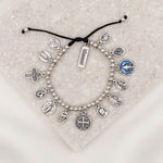 Glory Saints & Angels Bracelet silver tone saint medal charm bracelet on black slip knot cording with blessed charm tag
