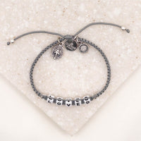 overhead of slate silver Little Words Project and My Saint My Hero Loved Bracelet