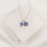 Vintage Blessing Lineage of Love Necklace with a silver tone four way and a blue enamel Miraculous Medal on a silver tone chain 