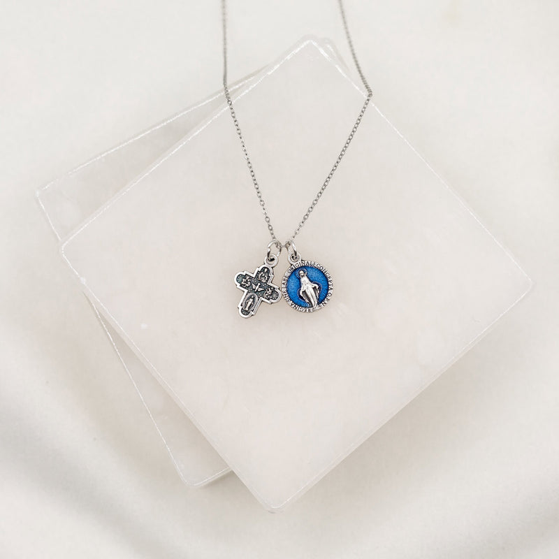 Vintage Blessing Lineage of Love Necklace with a silver tone four way and a blue enamel Miraculous Medal on a silver tone chain 