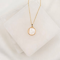 Mother of Pearl Mother Mary Necklace, close up, gold chain