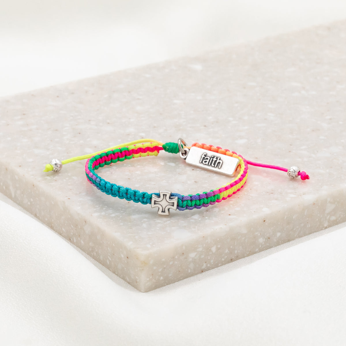 rainbow cording woven slip knot bracelet with silver tone medal and silver tone faith tag