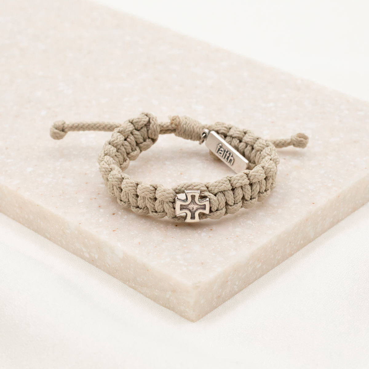 Strength Bracelet for Kids and Teens tan cording silver cross and faith charm tag