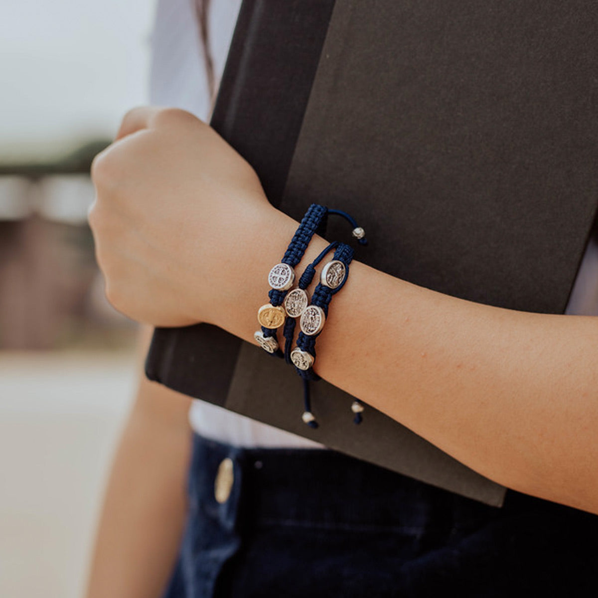 Young girl wearing Navy Benedictine Blessing Bracelets for Kids, Archangel Michael String Bracelet and Protection Archangel Michael for Kids in  navy