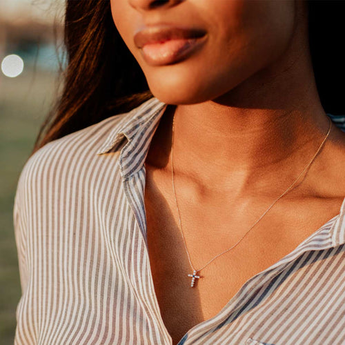 Woman wearing Heart of Mary Diamond and Sapphire Necklace