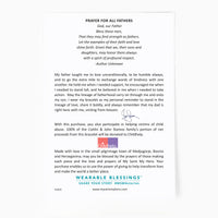 The back of the A Father's Love Blessing for My Child Bracelet with the story of the inspiration behind the bracelet by John Stamos