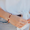 Woman wearing Amore Crystal and Benedictine Blessing Bracelet