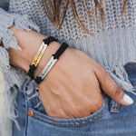 closeup of a woman's hand wearing two Be Not Afraid Bracelets