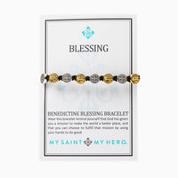 Benedictine Blessing Bracelet with black cording silver and gold St. Benedict medals on a product card