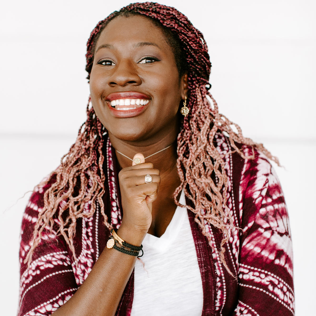 Young woman wearing a Petite Necklace and Blessing Bracelets