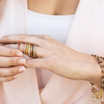 Woman wearing Blessing Bands and a God is Greater Ring