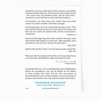 the back of the My Saint My Hero Breath card with Bible verses and a quote from Father John 