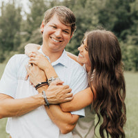 Coach Chad Prewett and Madison Prewett wearing Family Virtues My Saint My Hero Bracelets