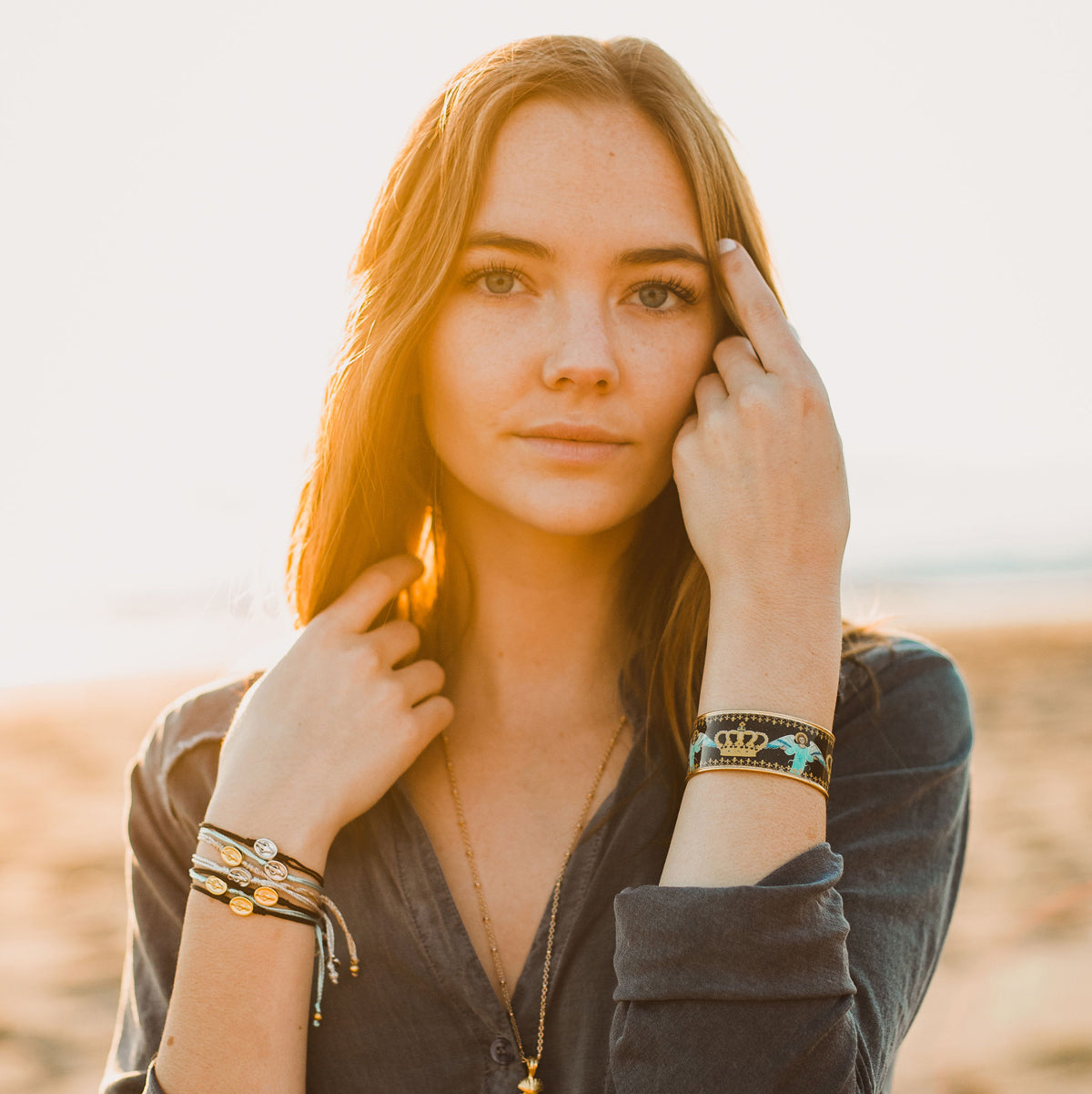 Woman wearing Miraculous Mary Say Yes Dainty String Blessing Bracelets and Sacred Icon Royal Crown Cuff