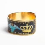 Side of the Crown of Glory Cuff depicting an angel and a crown on a black background