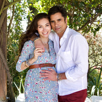 Caitlin and John Stamos wearing Share the Love StAmos Blessing Bracelets