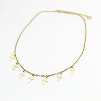 overhead shot of gold tone Walk by Faith petite cross Choker