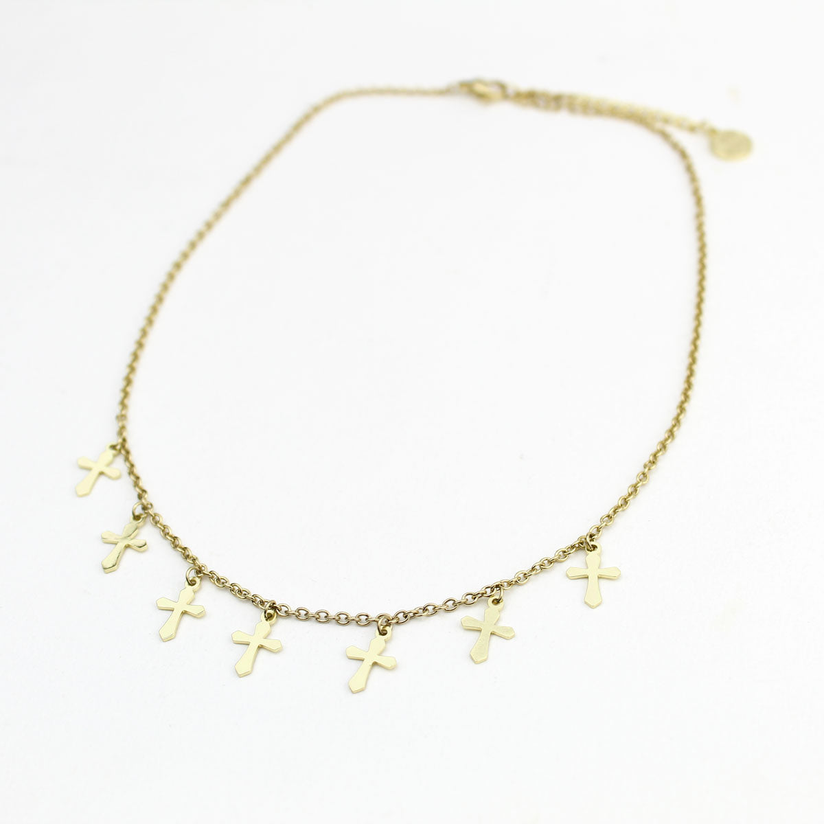 overhead shot of gold tone Walk by Faith petite cross Choker