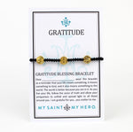 Gratitude St. Benedict Blessing Bracelet on customizable gifting card, gold tone St. Benedict Medals and black crystals