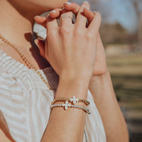 Living Lent Blessing Bracelets on woman with her hands clasped praying
