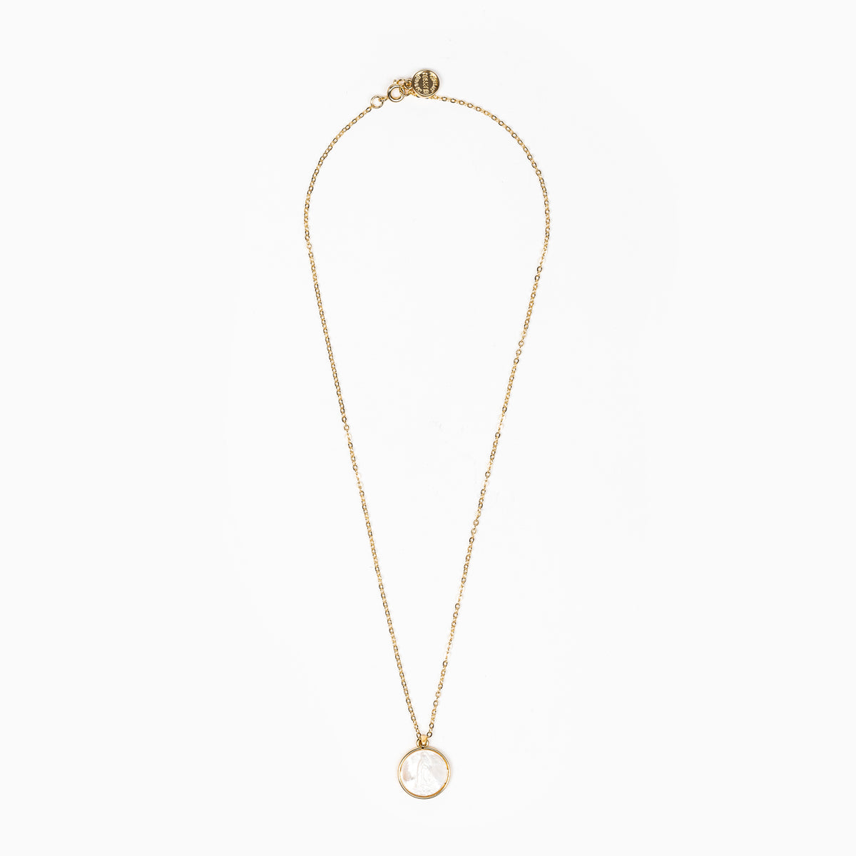 18" gold chain with small gold round logo charm at the clasp, round mother of pearl carved Mary pendant, shot overhead on white background