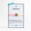 New Day Serenity Bracelet with rainbow cording and gold tone medal on inspirational card
