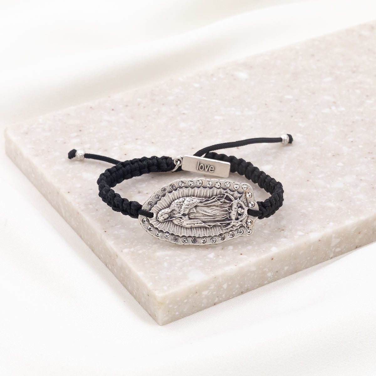 Antique silver-tone Our Lady of Guadalupe medal with crystals, signature tag