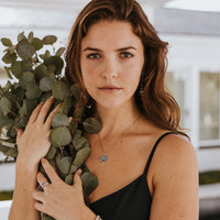 Pillar of Faith Ring - Sterling Silver on woman holding leaf bouquet