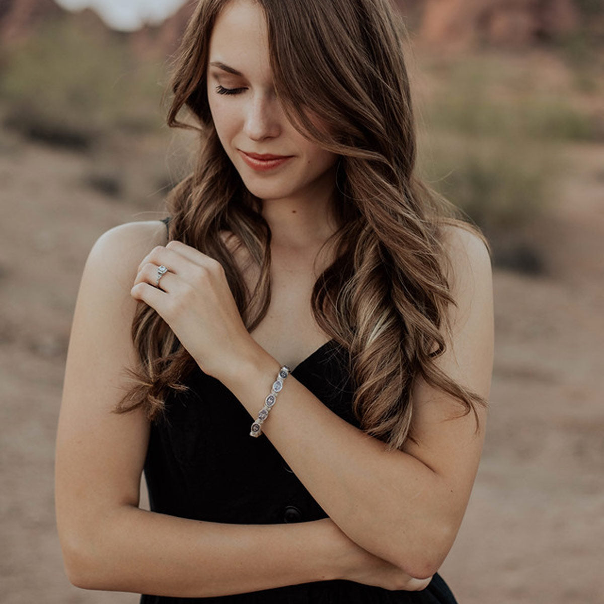 Girl wearing Protection Archangel Michael Bracelet tan cording silver medals