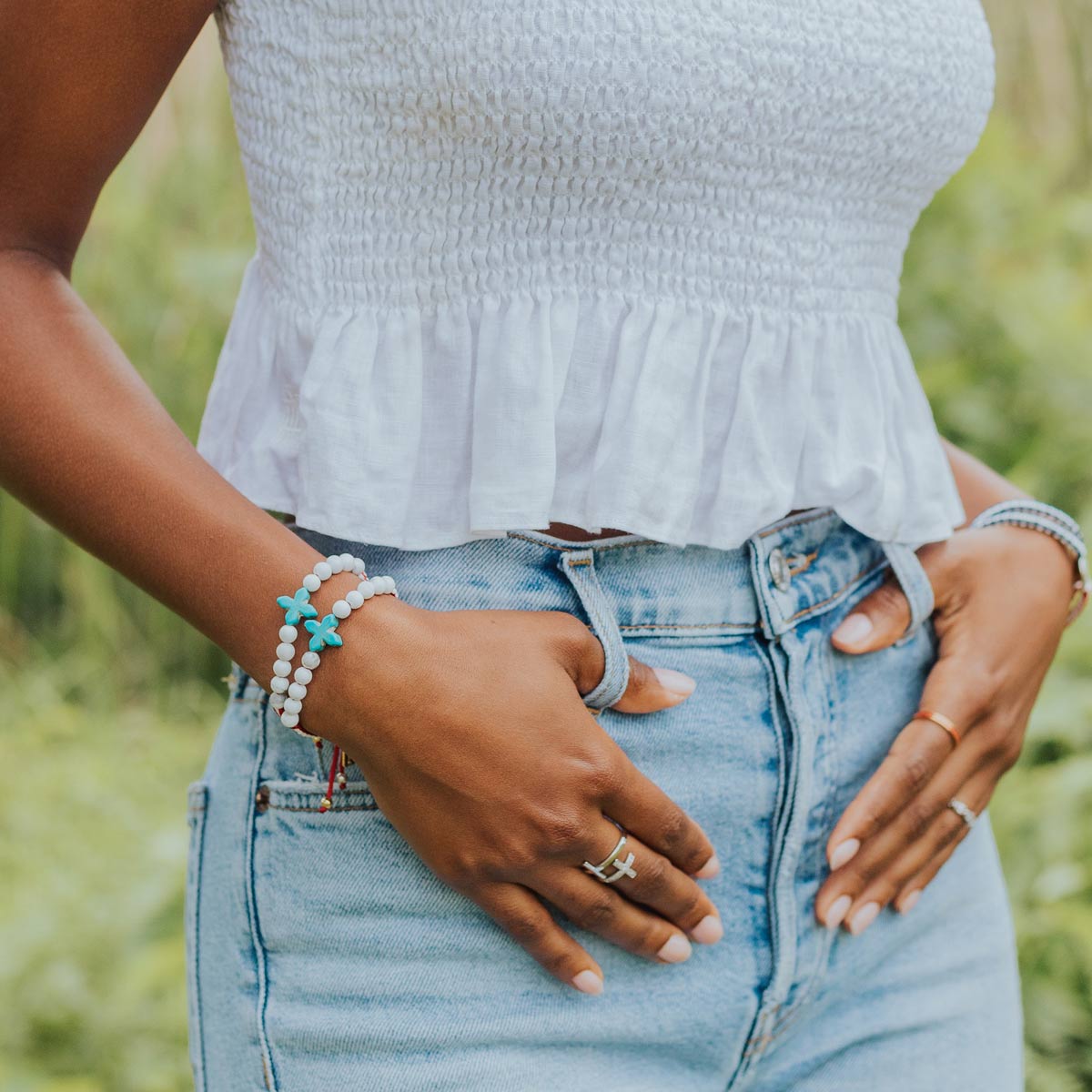 Close up of Woman wearing a United in Prayer Gemstone Bracelets